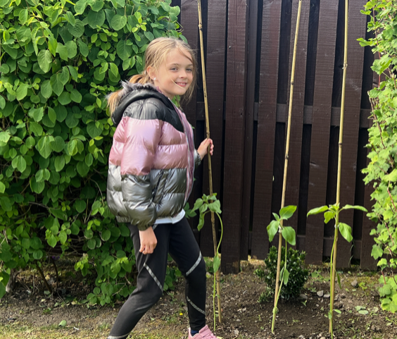 John M and Emily planting her sunflowers outside  2