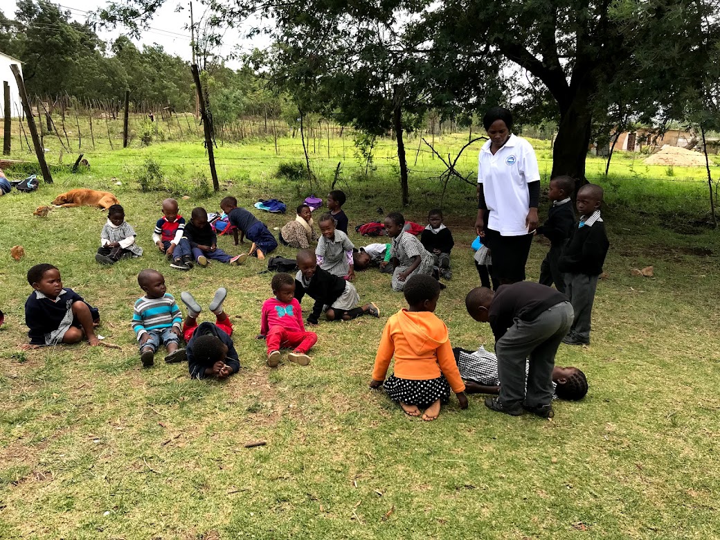 Teacher with group of children